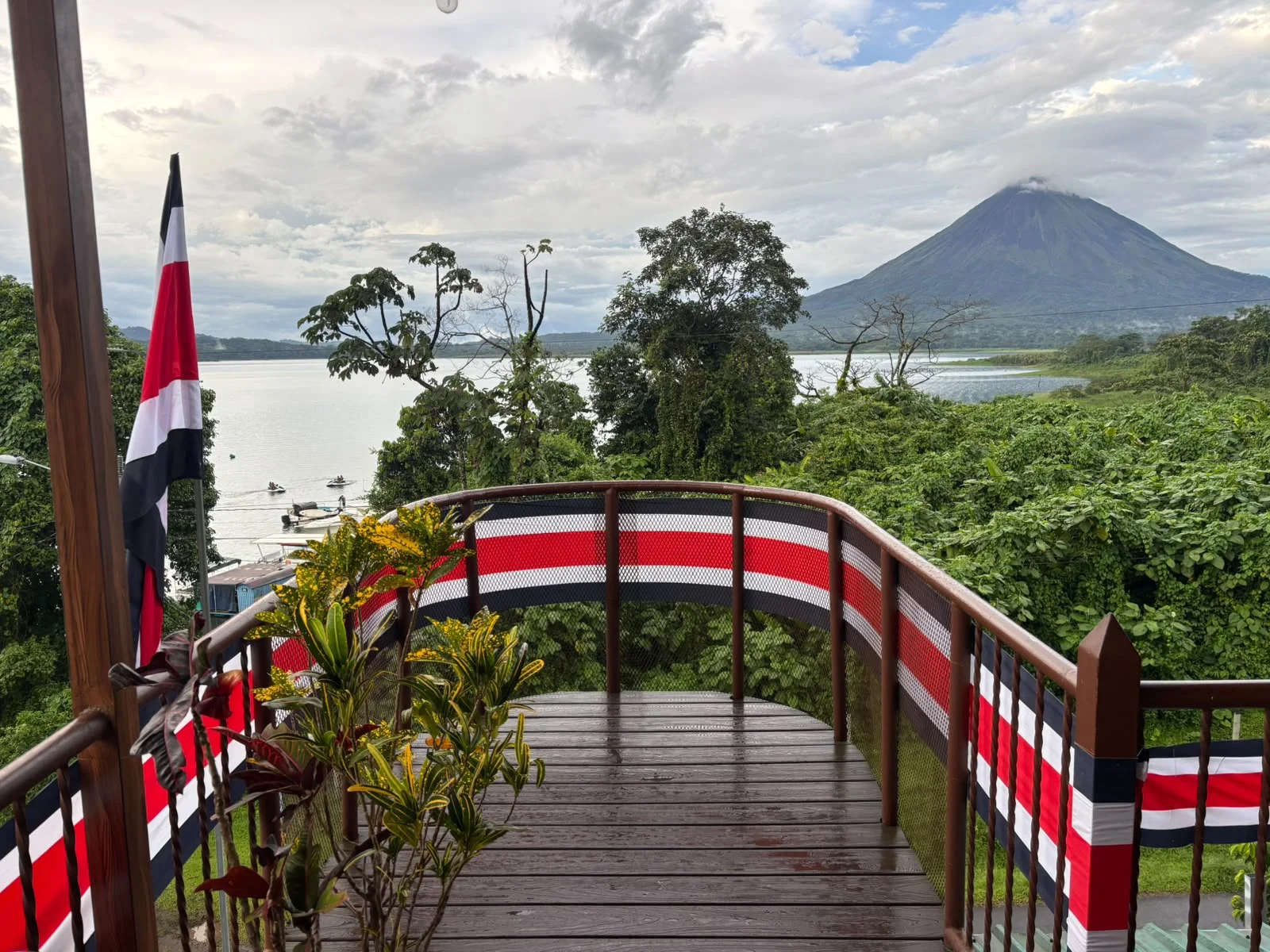 Mirador wooden observation deck overlooking Lake Arenal and volcano